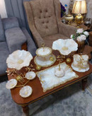 سرویی پذیرایی رزینی طرح کرم طلایی مرمر سنگ رگه دار پایه برگ برنجی